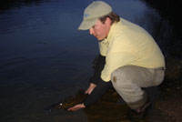 Britt releasing a trophy New River smallmouth